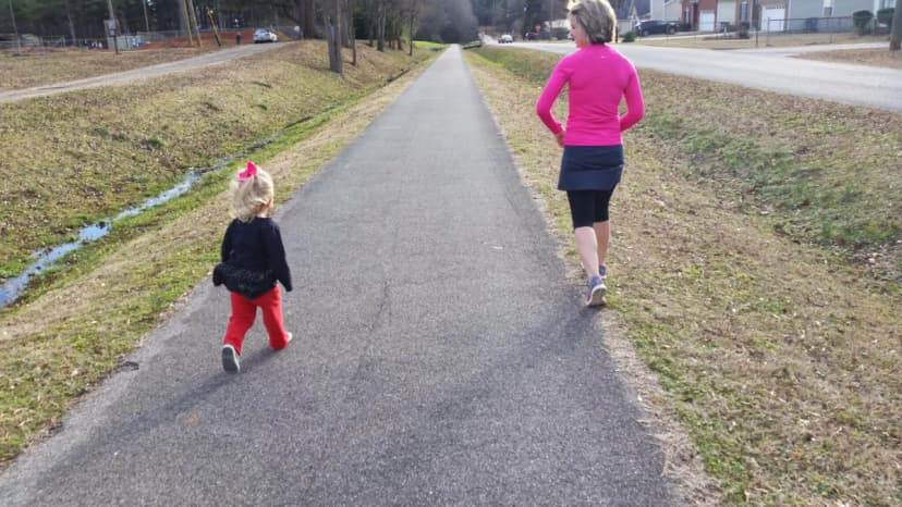 Heather running alongside two young children on bikes on the Chief Ladiga Trail, fall 2017, Weaver, Alabama