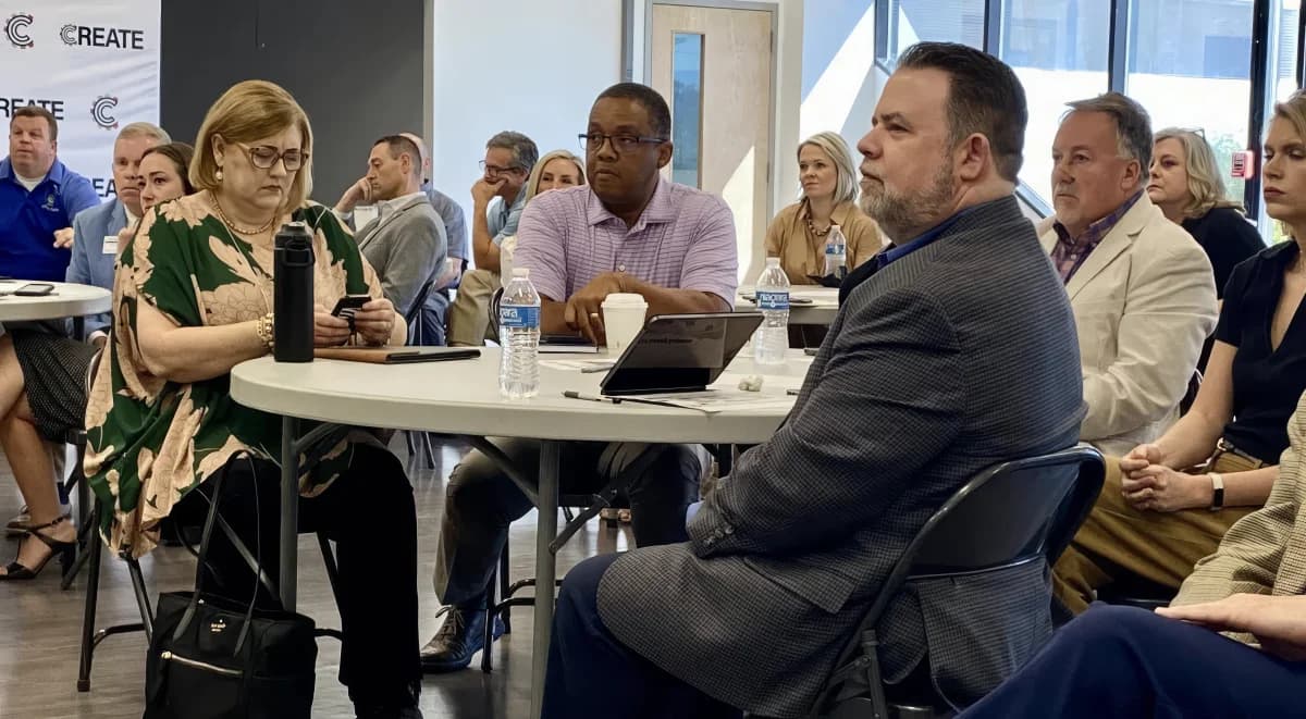Shannon Jenkins listening at a community meeting at CREATE Anniston