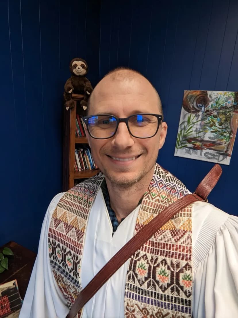 Matt Headley in clergy stole, New Year's Eve 2023