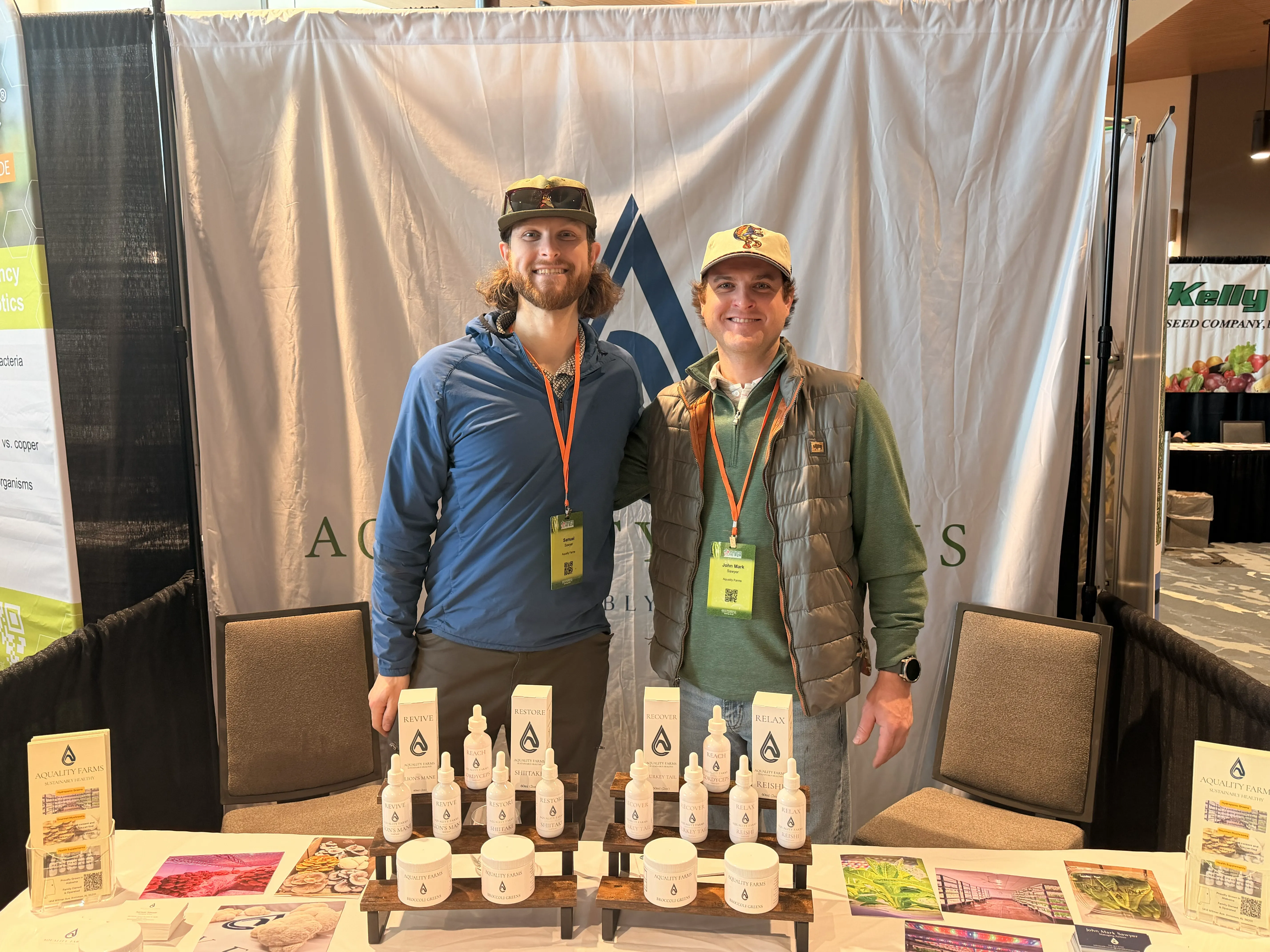 Samuel and John Mark Sawyer at the Aquality Farms booth with their mushroom grow kits and products