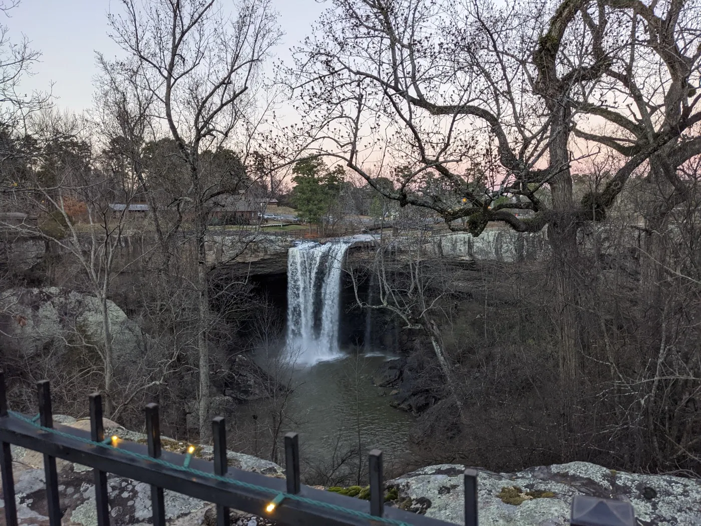 Noccalula Falls at dusk with Christmas lights on the overlook railing, Gadsden, Alabama